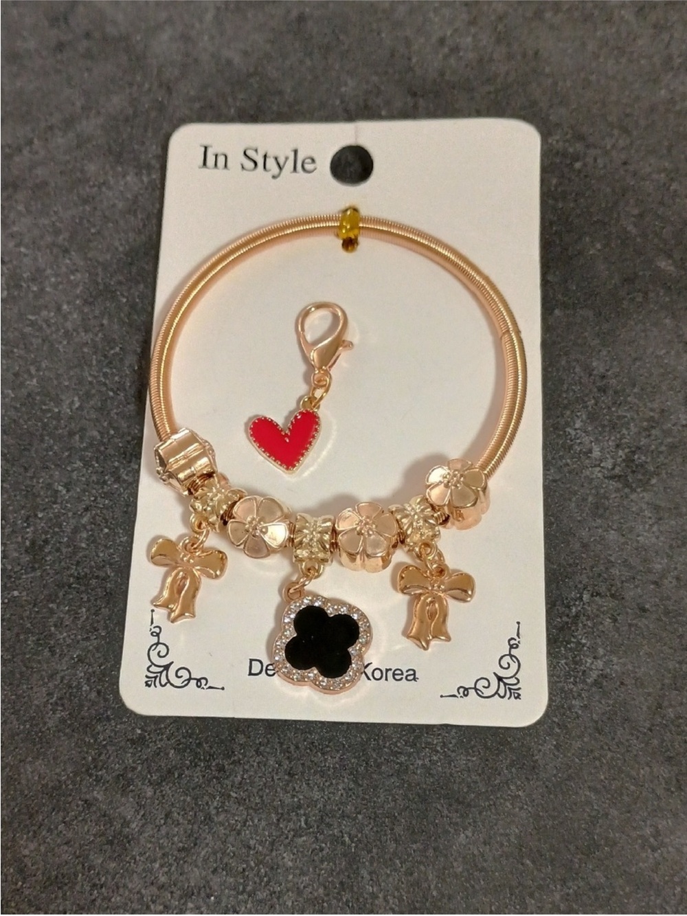 Gold-Tone Charm Bracelet with Black Clover and Red Heart Charm